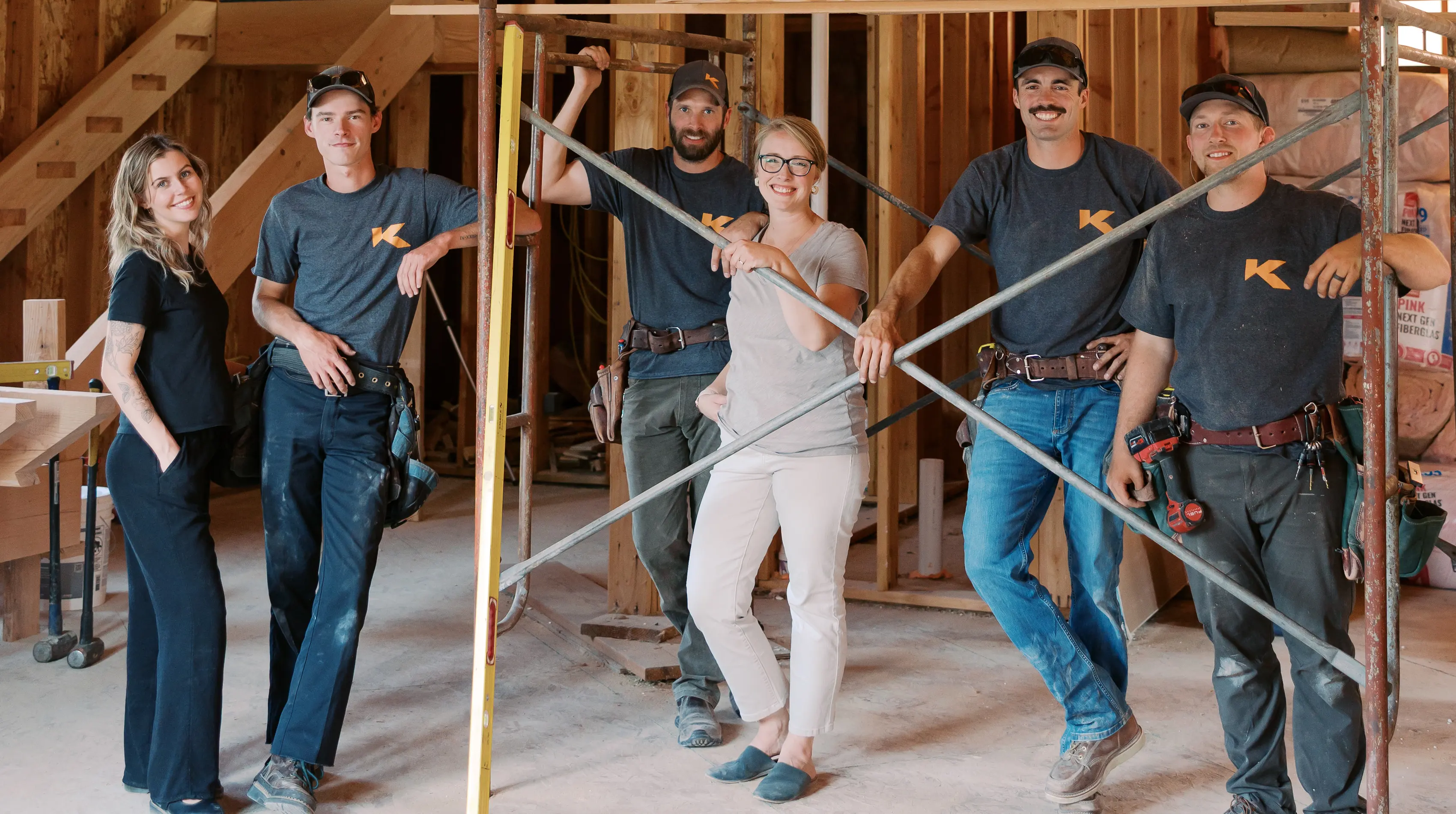 The whole KCW team inside a home under construction